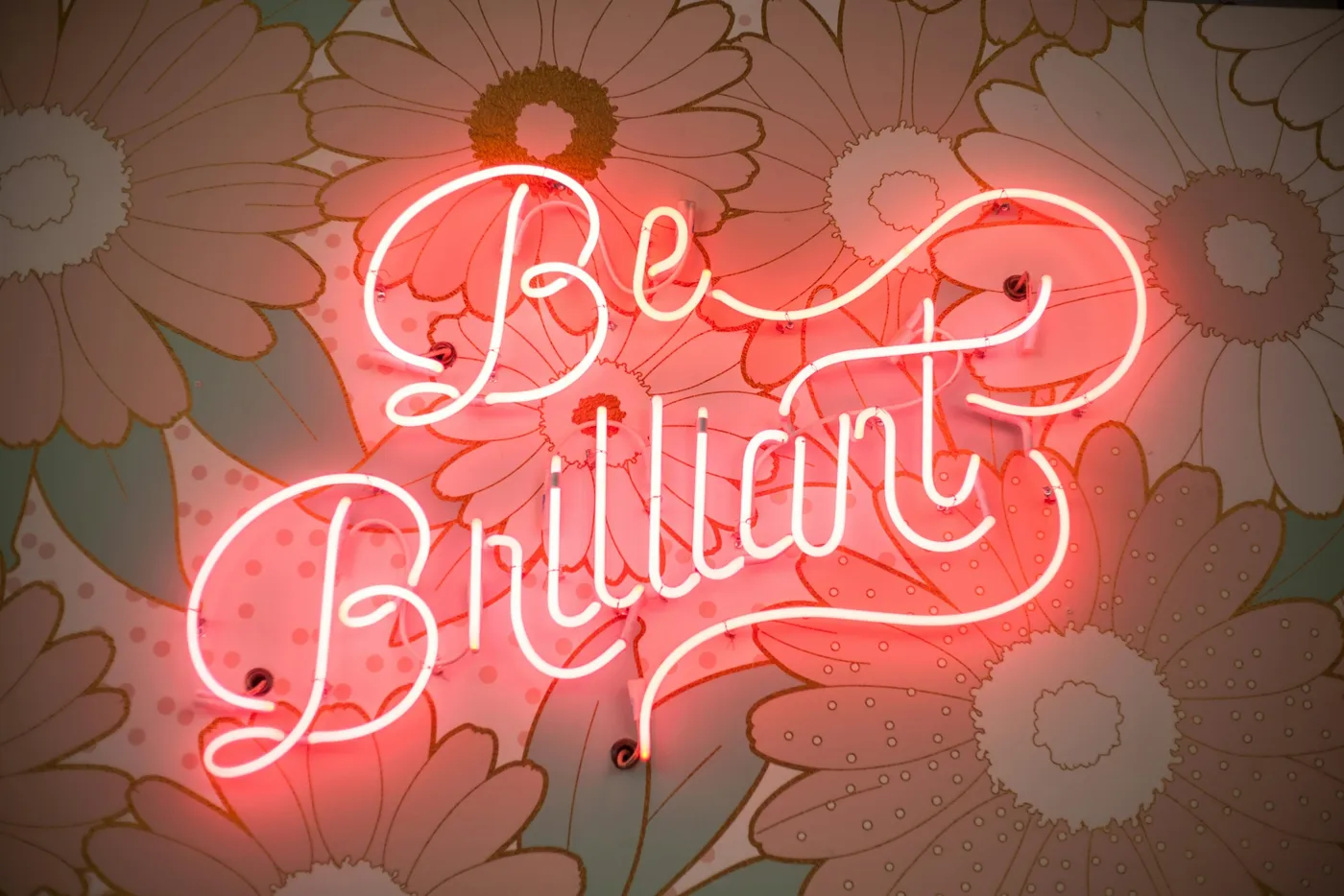 Neon sign reading “Be Brilliant”